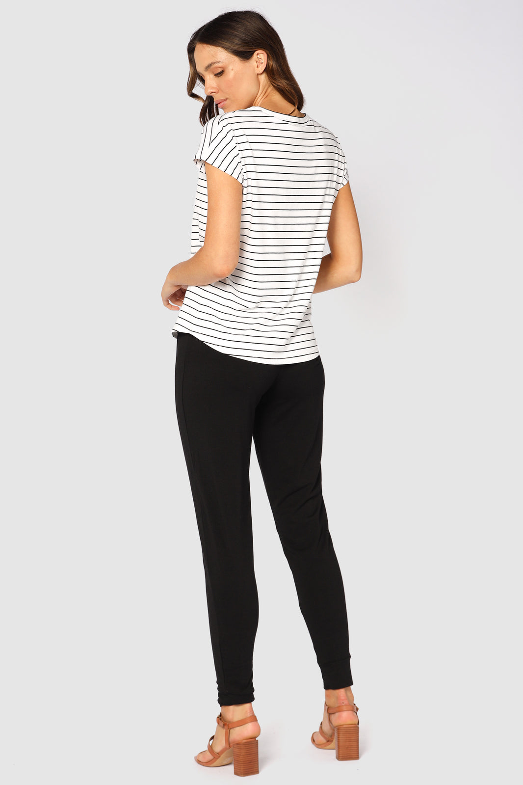 a back view of the bamboo slouch pants with cuffed ankles
