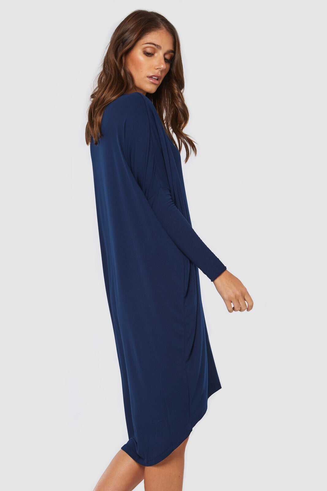Oversized navy dress featuring long sleeves and v neckline