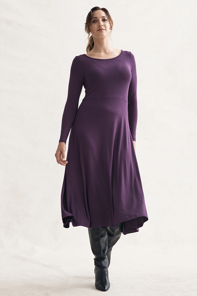 Long sleeve midi dress in purple with boots, perfect for cold weather.