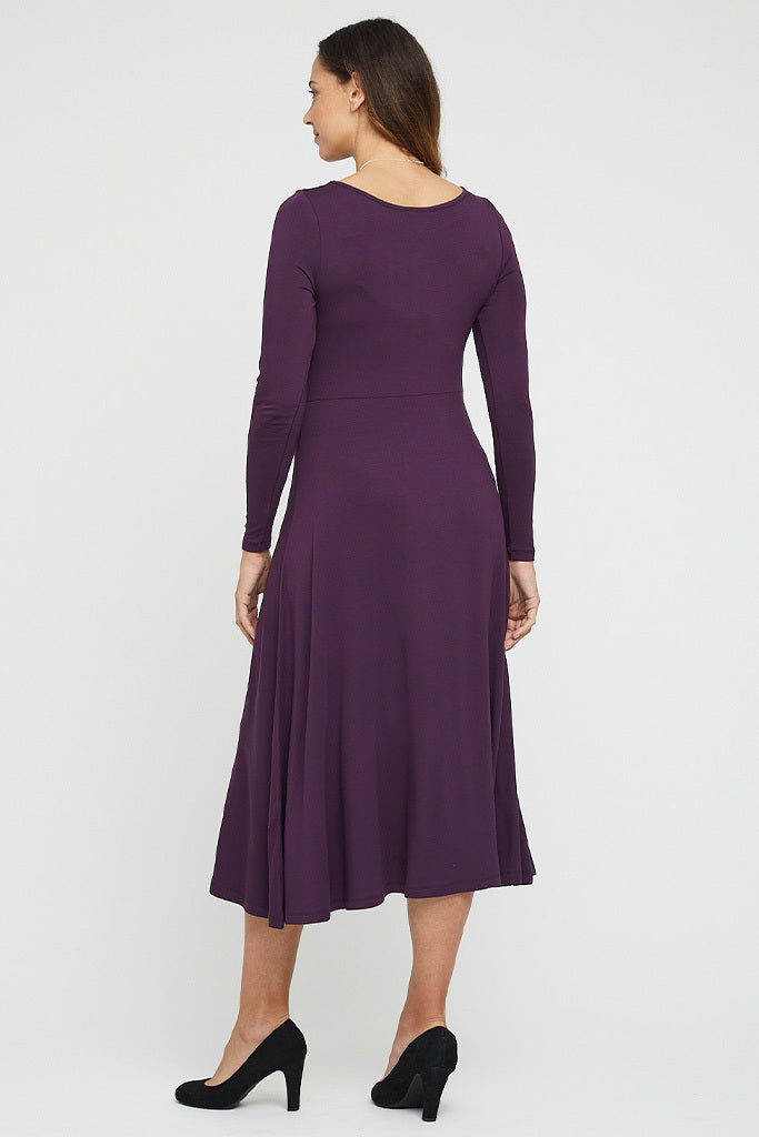 Back view of purple midi dress featuring a flowy skirt.