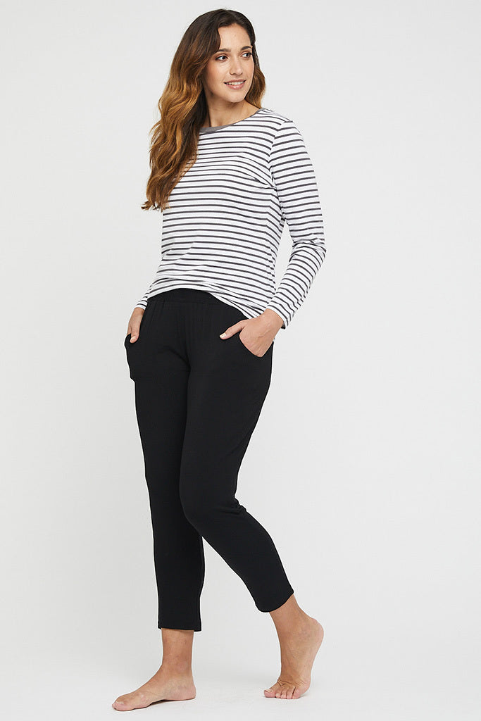 a woman wearing the Peggy pants with side pockets paired with a striped long sleeve top