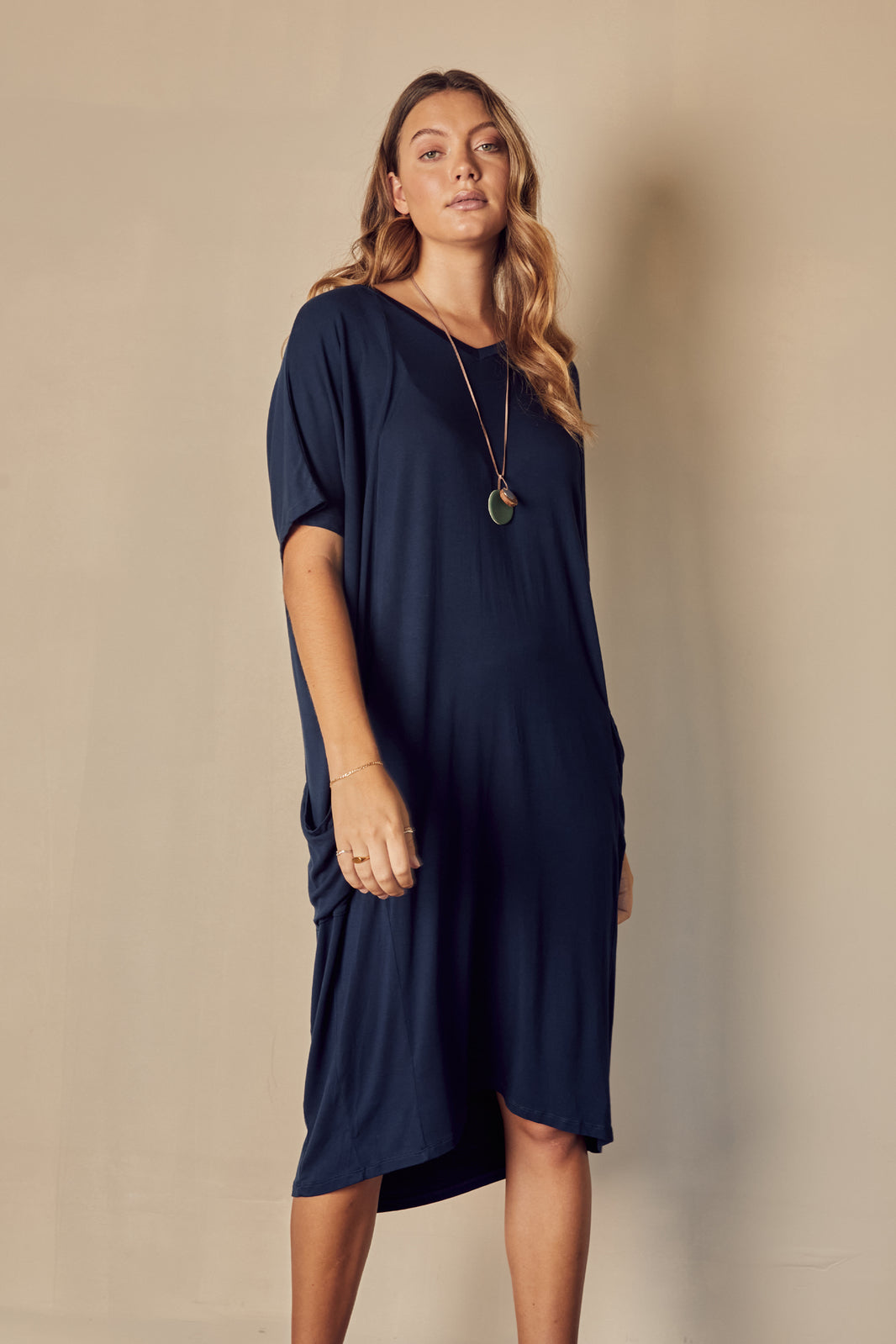Navy bamboo dress with v neckline and oversized fit.