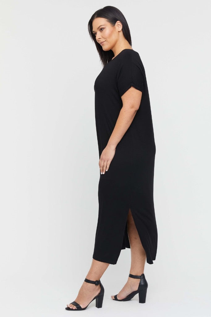 Side view of bamboo black maxi dress on model with flowy silhouette and soft fabric