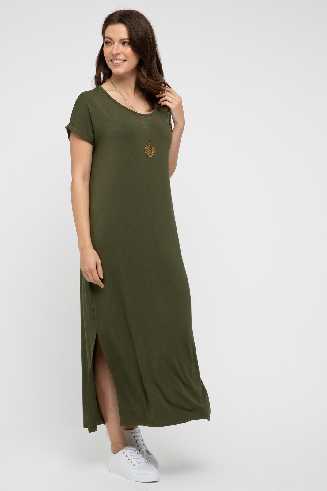 Model styled in dark olive bamboo maxi dress with soft fabric and flowing silhouette