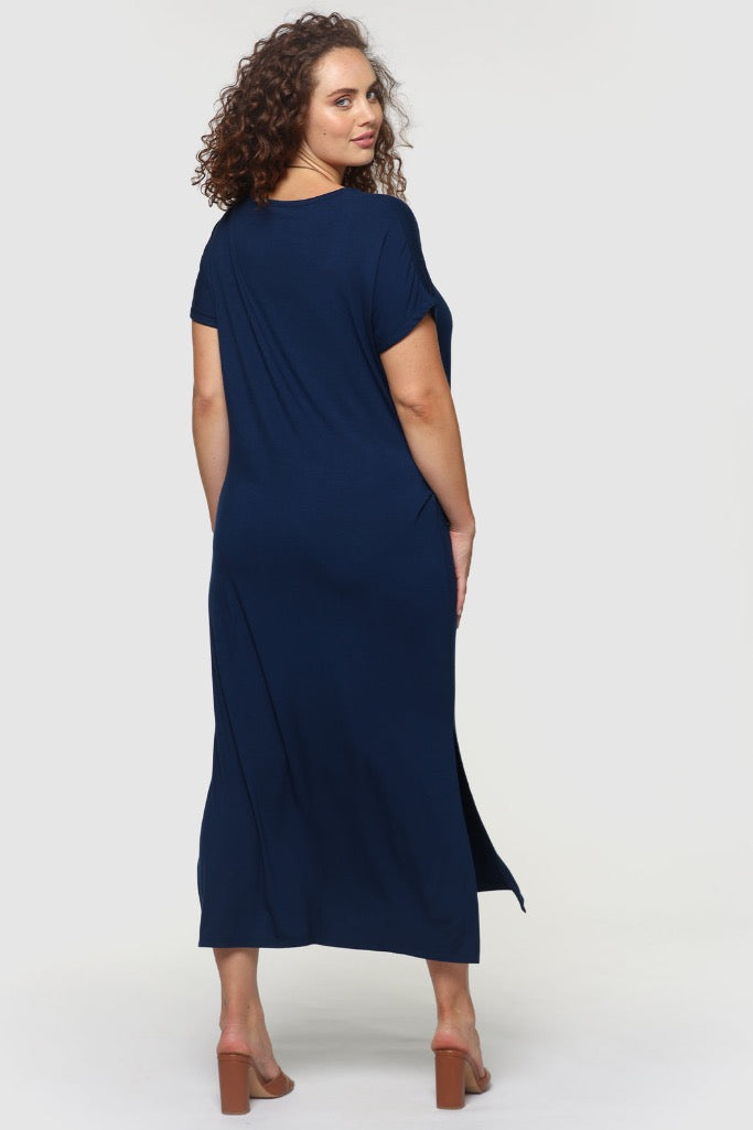 Back view of plus size navy bamboo maxi dress with knee-high side splits