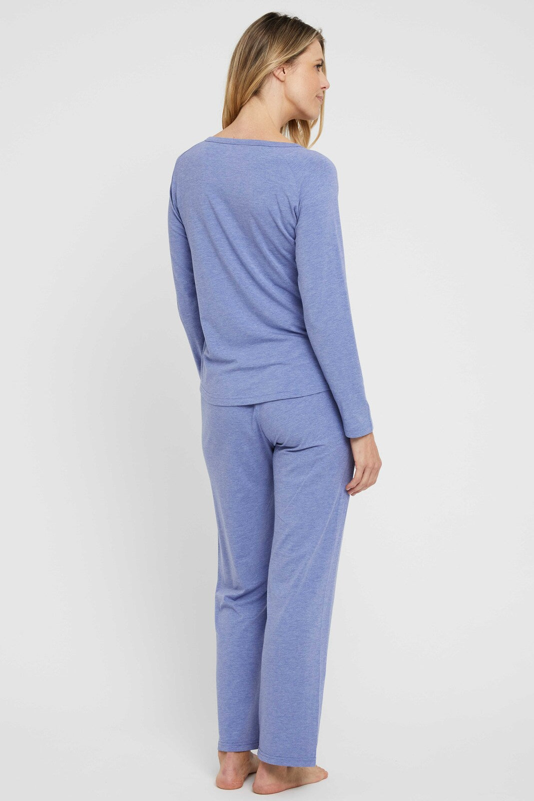 Back view of model wearing breathable and lightweight straight leg pyjama pants.