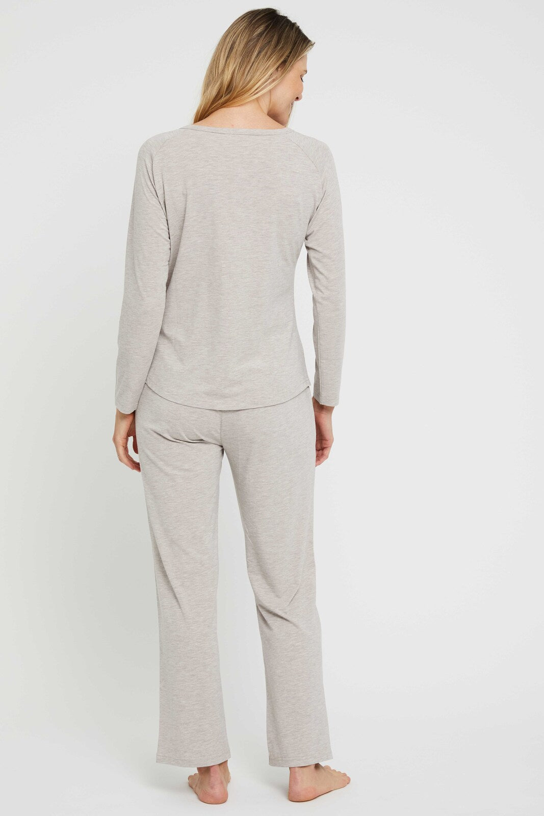 Back view of beige straight leg bamboo pants made out of hypoallergenic fabric - perfect for sensitive skin!