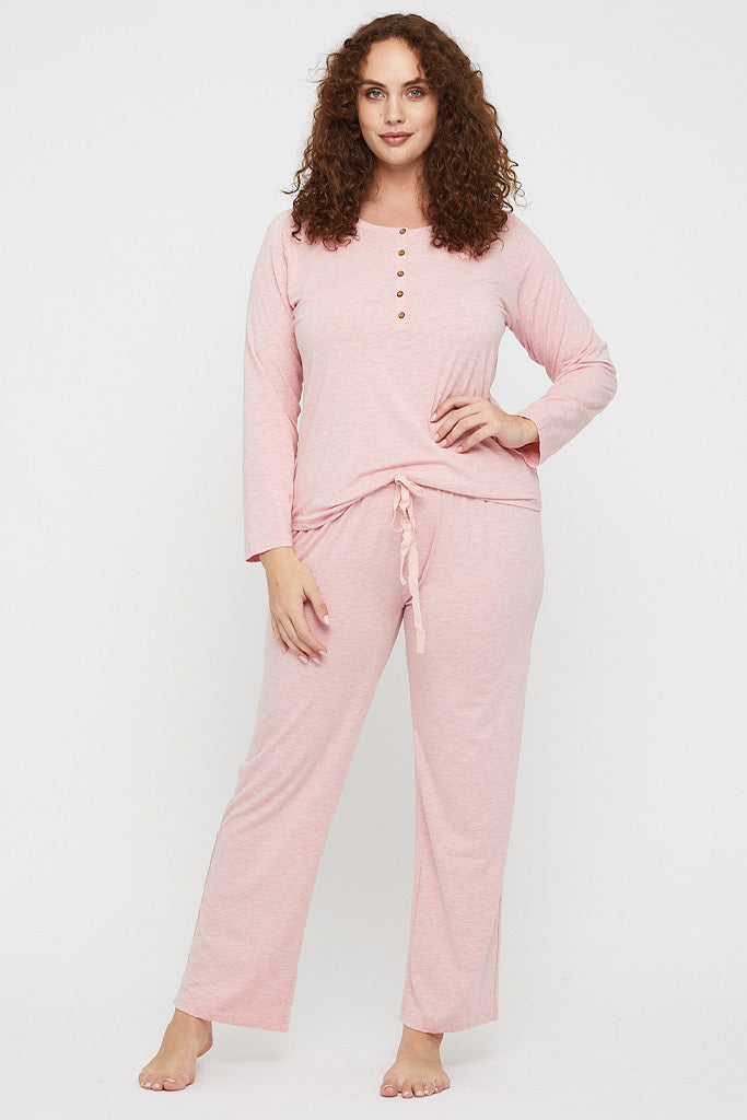 Plus size model wearing breathable bamboo pyjama pants with a straight leg.