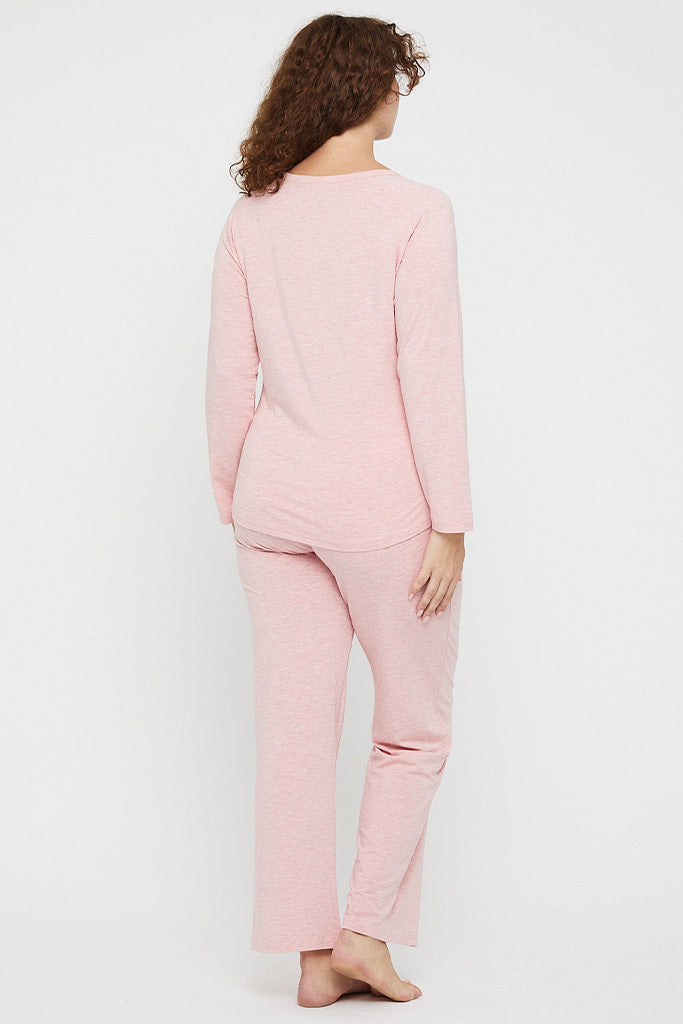 Back view of plus size model wearing straight leg pyjama bottoms in pink marle.