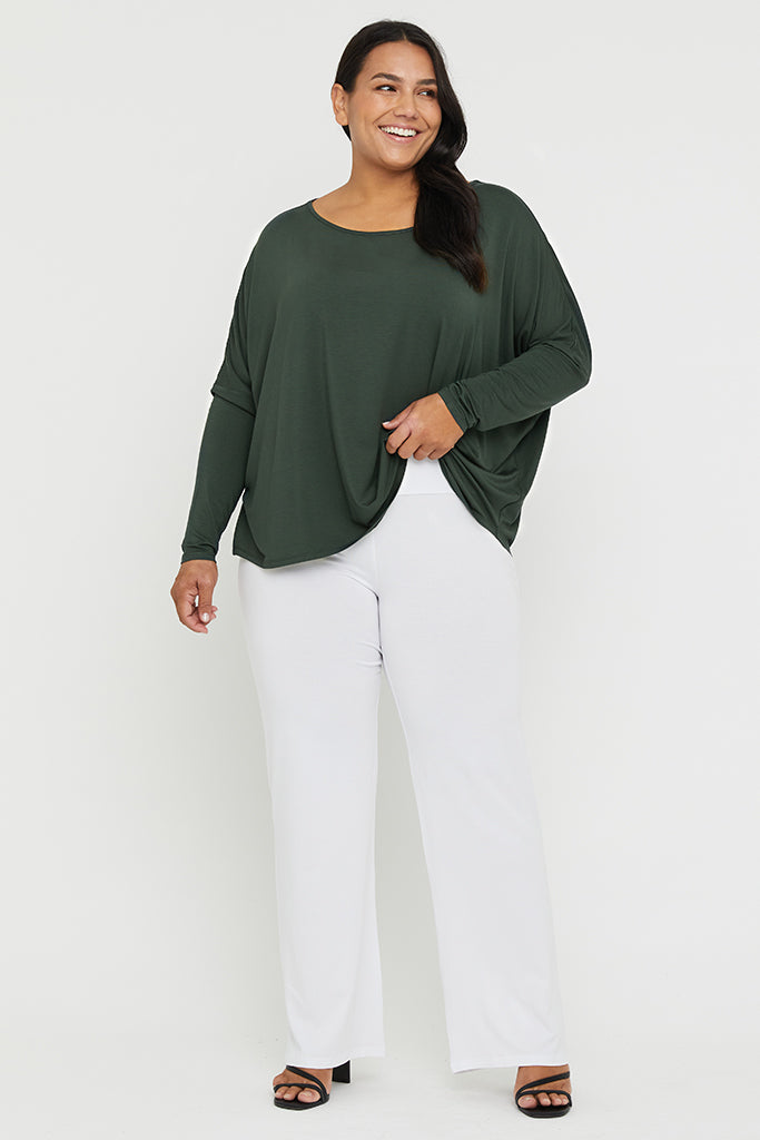 Plus size high-rise bamboo pants in white with a flattering straight-leg shape.
