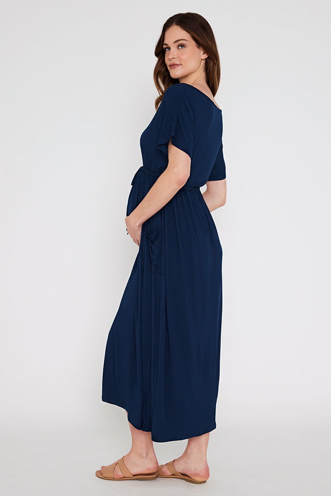 Side view of the maternity maxi dress in navy.