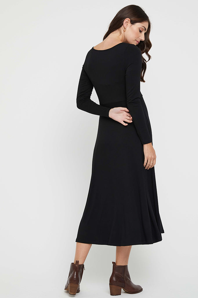 Black maternity dress with long sleeves ideal for cooler days and layering.