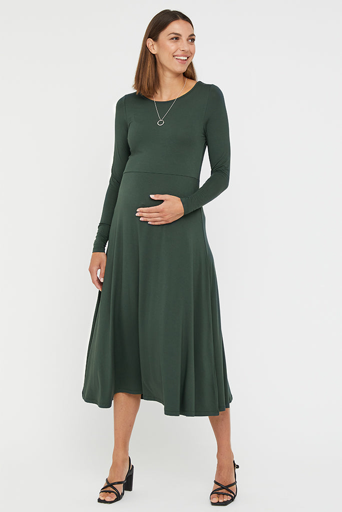 Front view of the bamboo maternity dress in green with round neckline and slim fit at the bust.