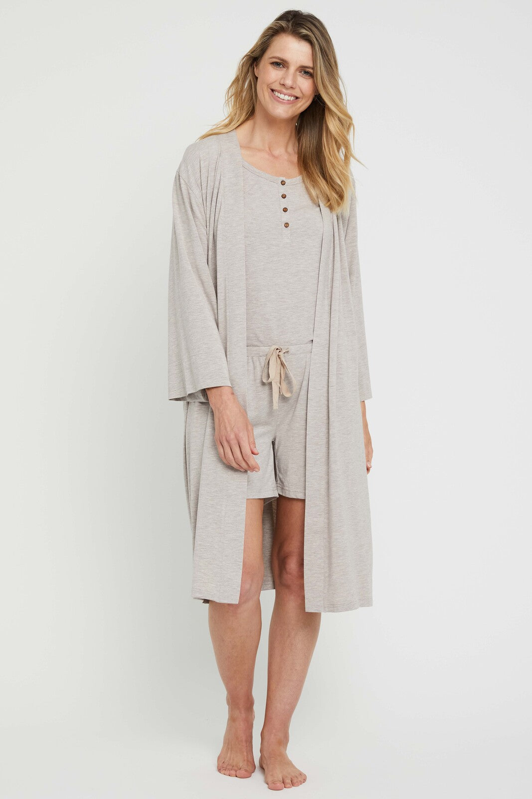Model wearing a beige bamboo dressing gown paired with matching PJ set