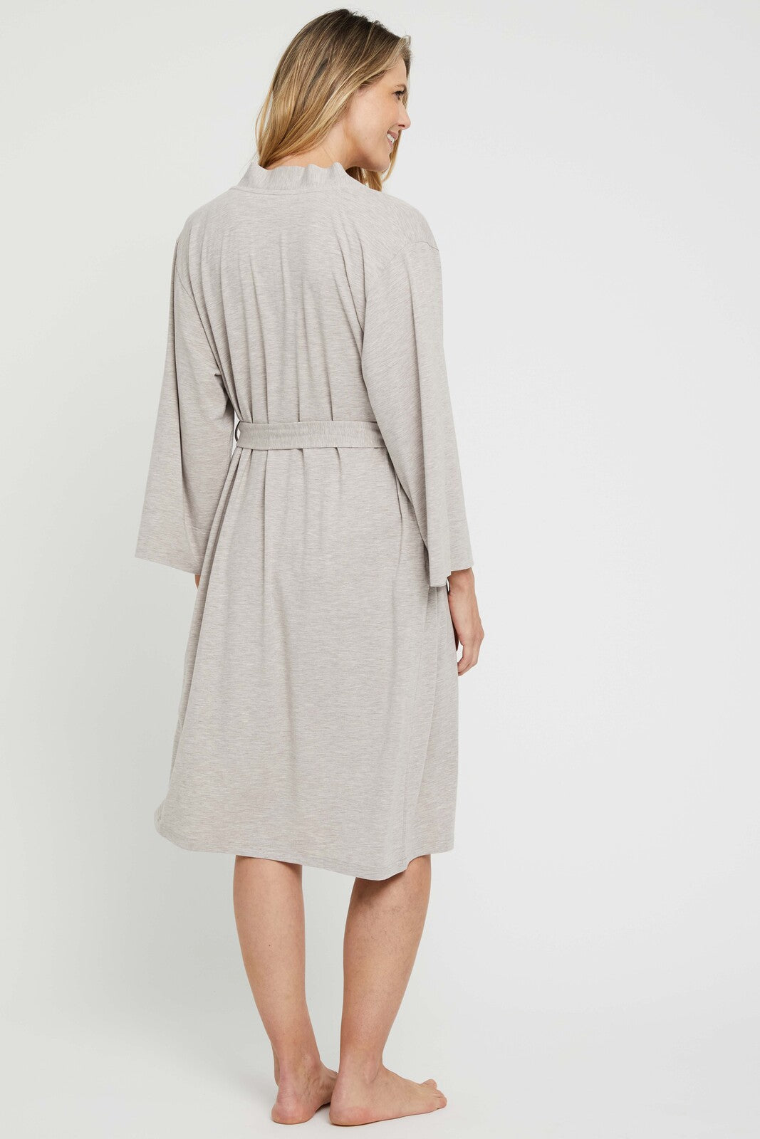 Back view of beige dressing gown featuring wide sleeves