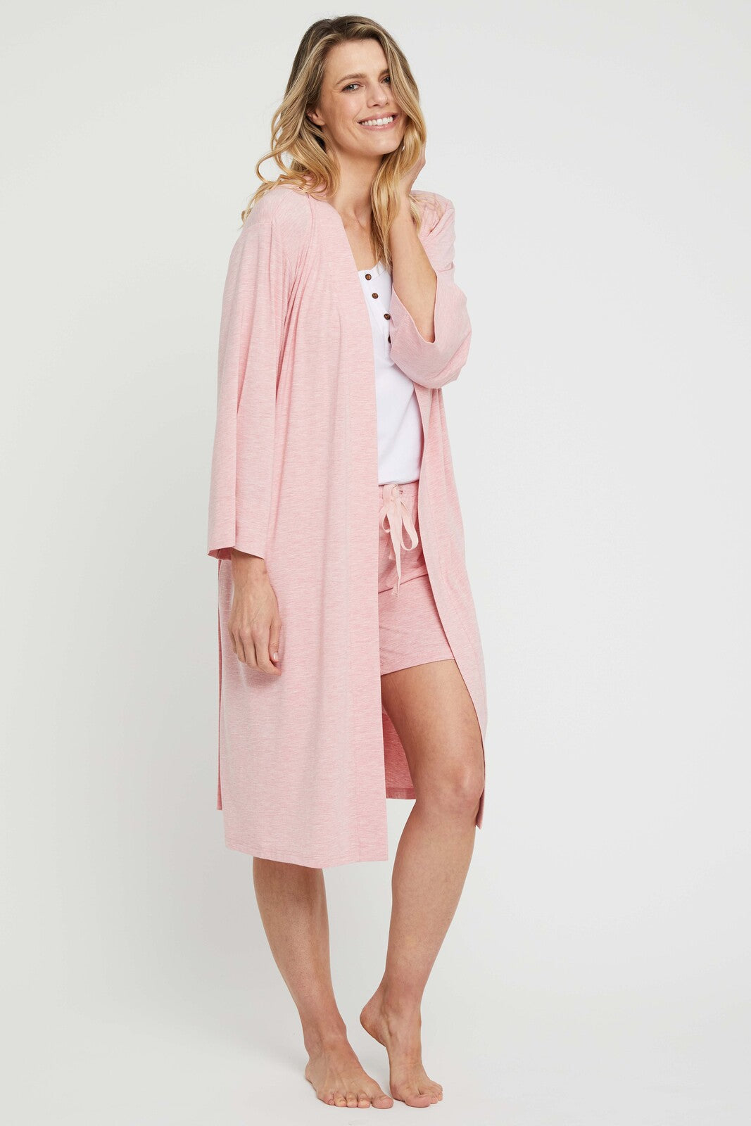Model wearing a kimono styled robe in rose pink marle
