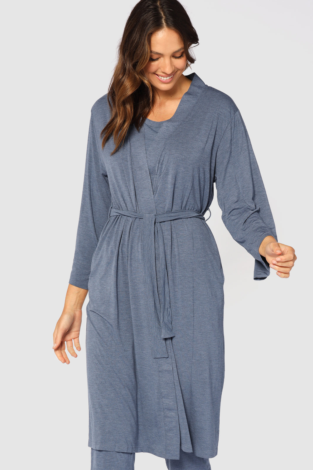 Closeup of comfortable and cosy blue dressing gown, featuring wide sleeves and belt