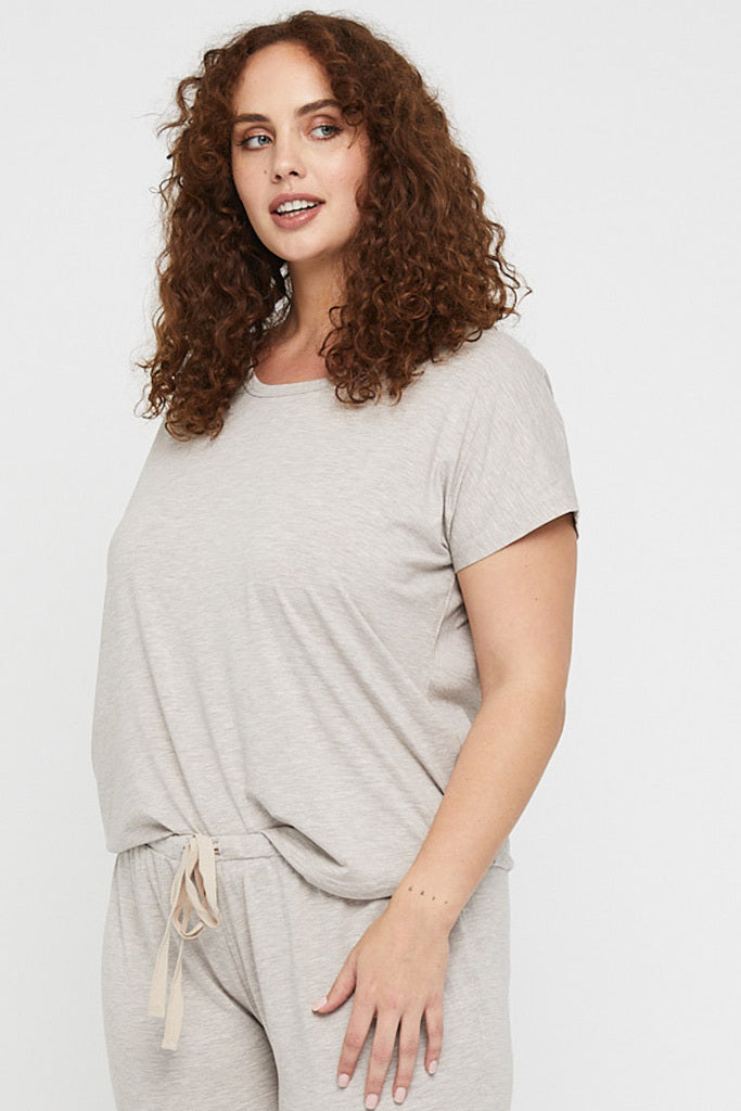 Curvy model wearing a soft and lightweight beige pyjama tee