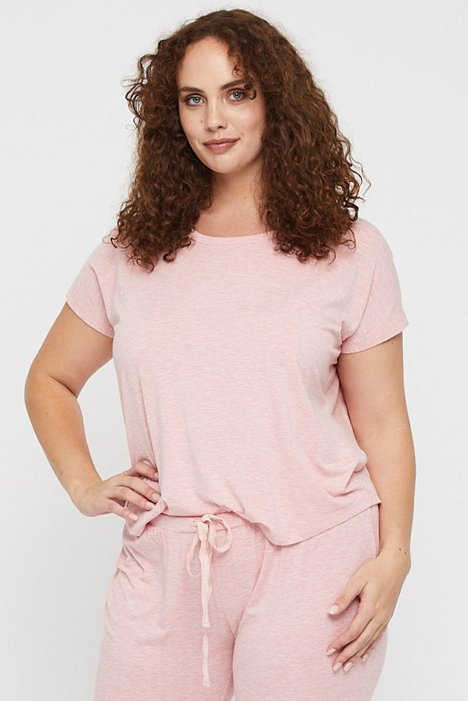 Curvy model wearing a bamboo pink lounge tee featuring a round neckline, short sleeves and a curved hemline.