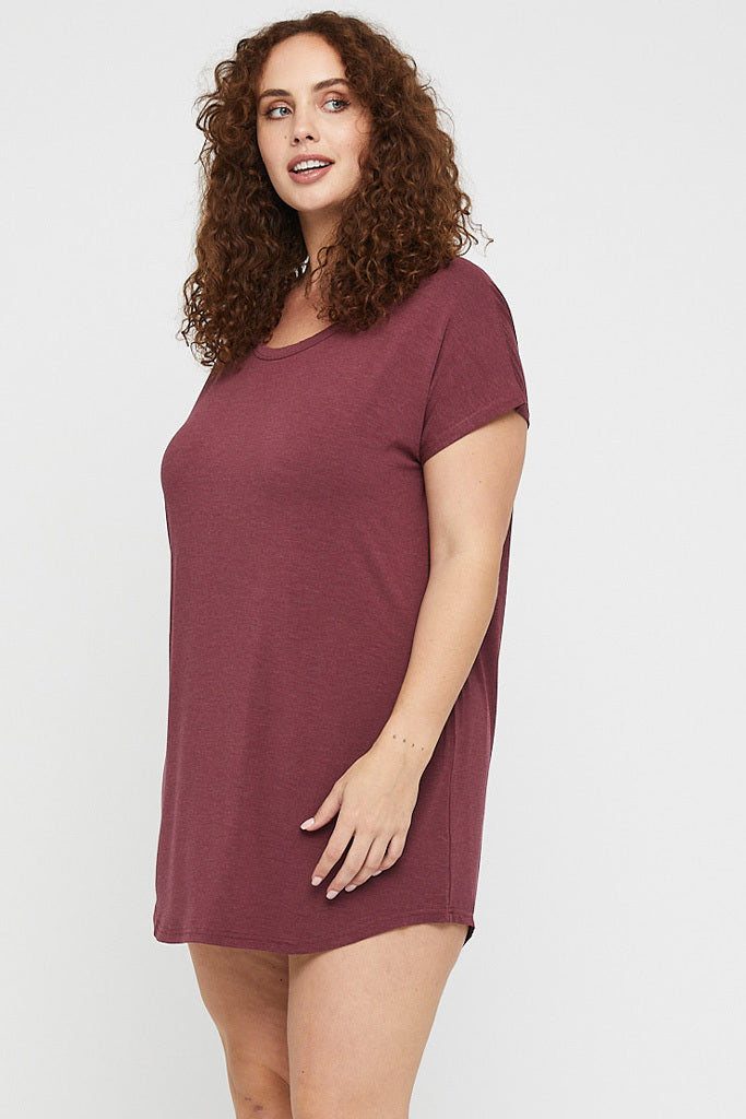 Curve model wearing an above the knee night dress in Burgundy marle.