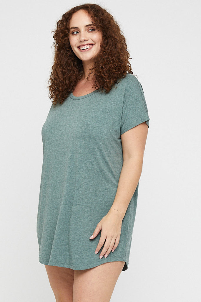 Side view of curvy green night dress made out of breathable hypoallergenic fabric.