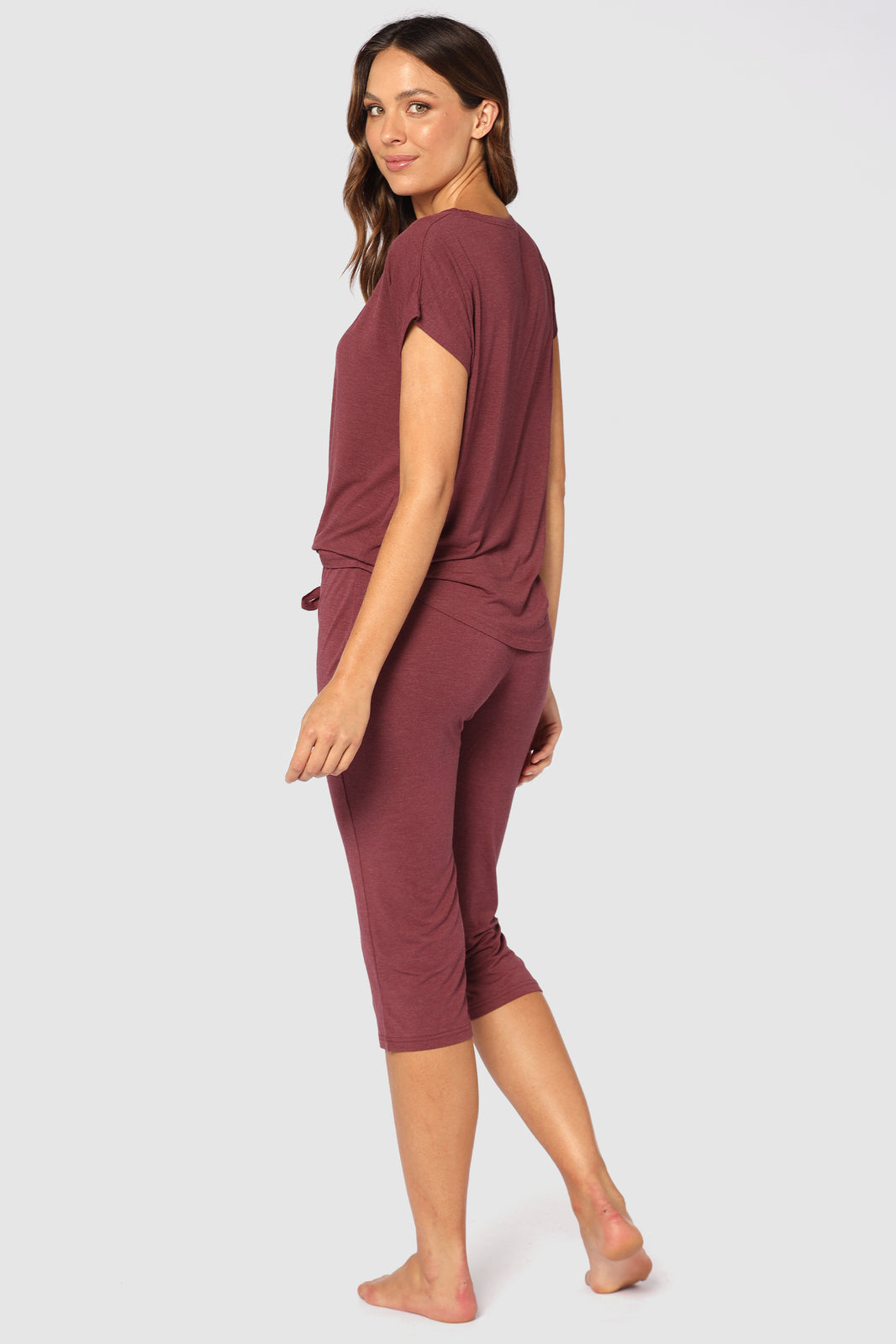 Back view of model wearing soft and breathable 3/4 PJ pants in burgundy, perfect for sensitive skin
