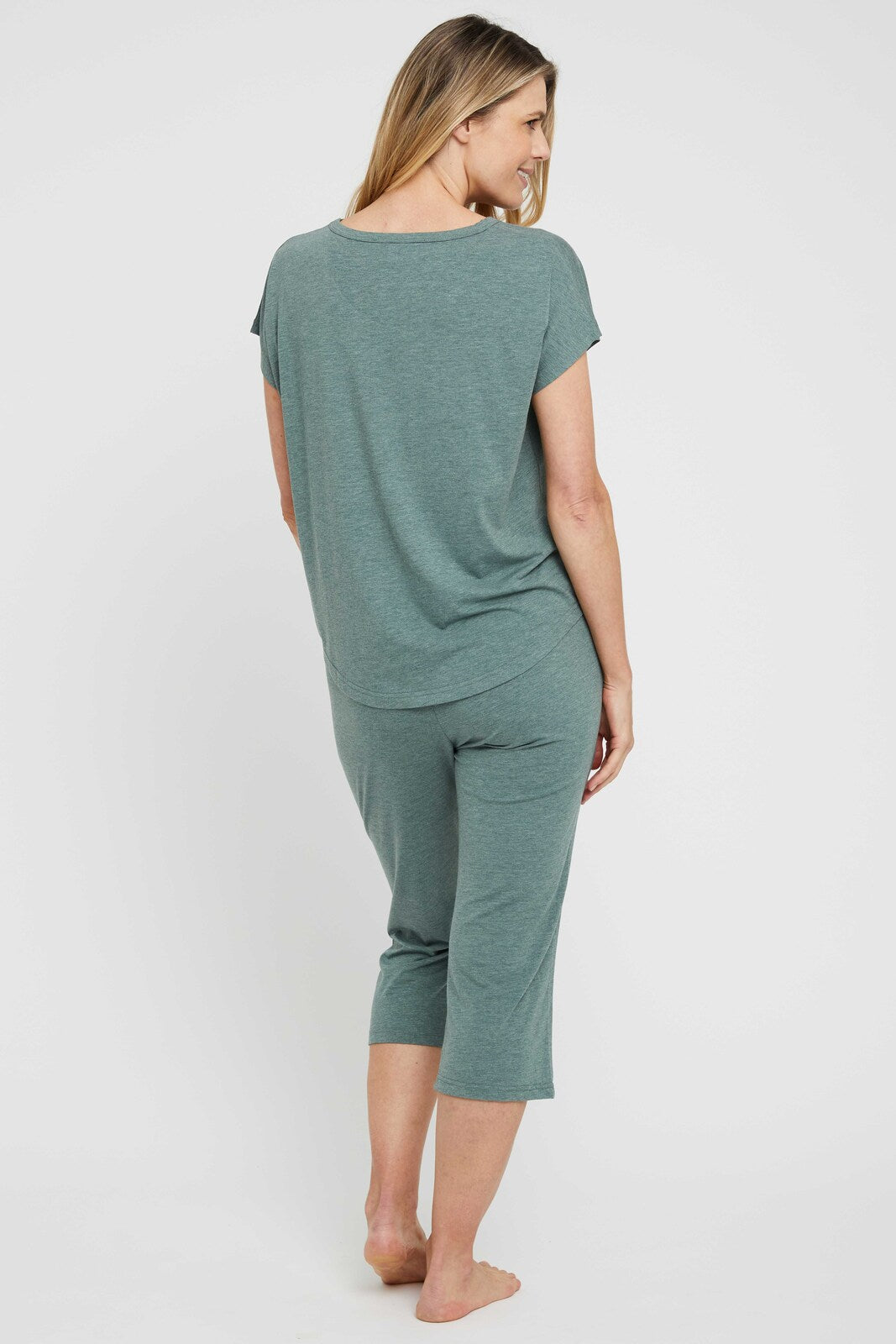 Back view of cosy 3/4 pyjama pants in moss green.