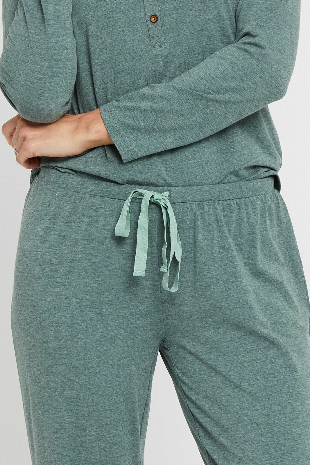 Close up of waistband and drawstring on green bamboo pyjama bottoms.