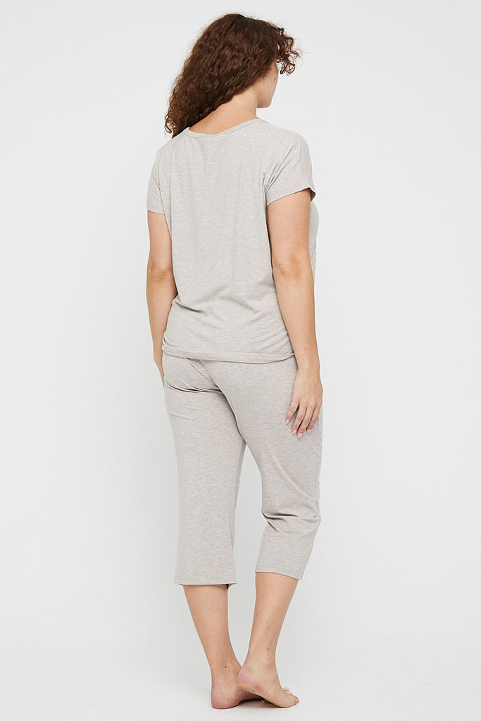 Back view of beige 3/4 length pyjama pants made out of hypoallergenic fabric.