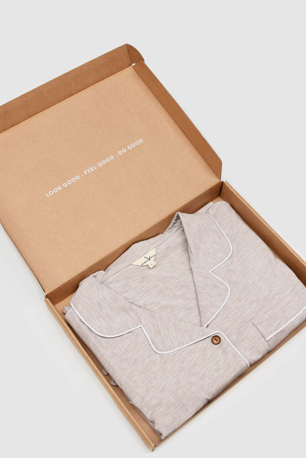 Ladies pyjama set in oatmeal packaged in a gift box.