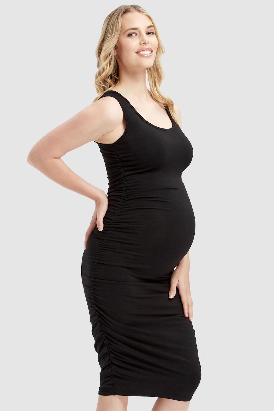 Stylish and comfortable maternity dress in black bamboo fabric featuring adjustable side ruching.