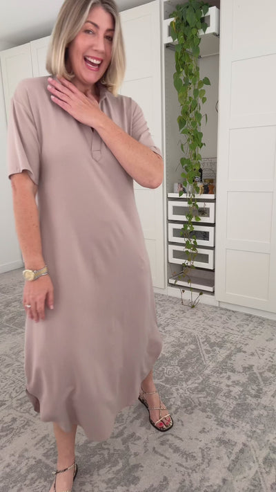Video of model explaining the features of a beige maxi dress